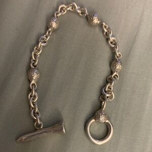 Golf inspired sterling silver bracelet.